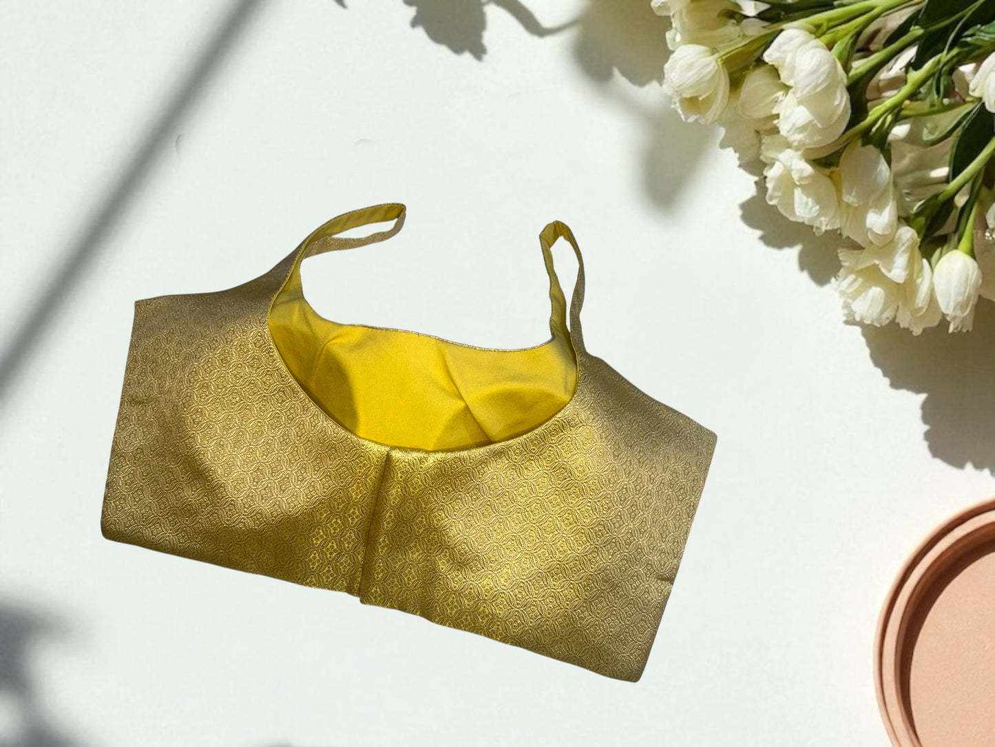 Golden sleeveless silk blouse